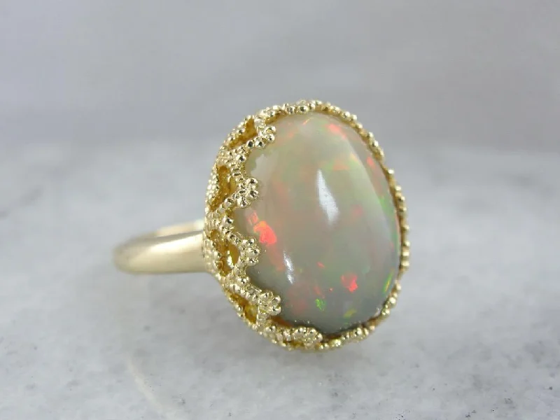 Iolite Gemstone Rings in 10K Gold with a Twisted Band for a Distinctive and Stylish AccessorySmoky Ethiopian Opal and Sensual Vintage Gold Cocktail Ring