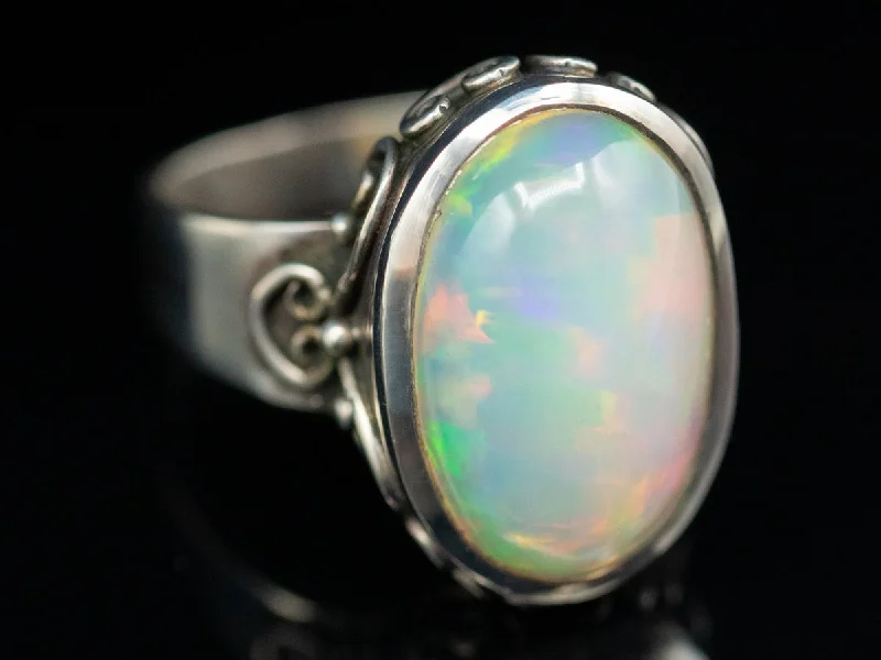 Aquamarine Gemstone Rings in 9K Gold with a Bezel Setting for a Modern and Secure FitExceptional Ethiopian Opal and Sterling Silver Ring