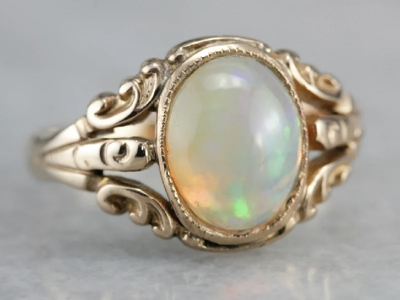 Aquamarine Gemstone Rings in 9K Gold with a Bezel Setting for a Modern and Secure FitAntique Opal Ornate Gold Ring